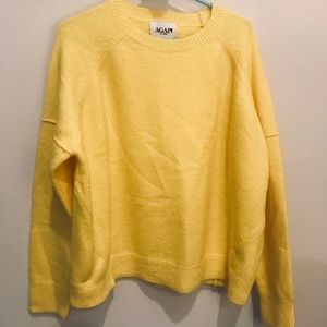 Again bright yellow sweater